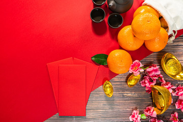 Chinese New Year offering red envelope chinese tea pot and orange , Translation of text appear in image: Prosperity, rich and healthy
