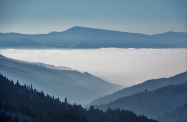 Naklejka na ściany i meble the fog between the mountains