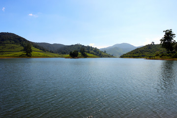Calm Lake With Green Mountain Stock Image