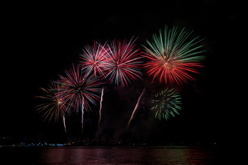 Colorful fireworks of various colors at night with celebration and anniversary concept