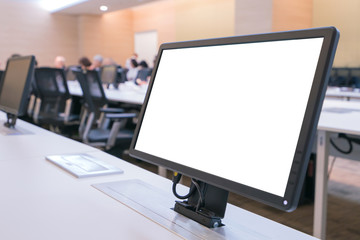 Business executive people group sitting at conference table with white blank mockup tv screen on table in meeting room.