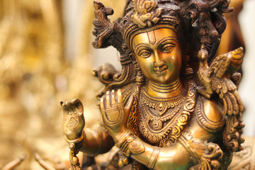 Fototapeta na wymiar Indian Lord God Krishna Made Of Brass Metal