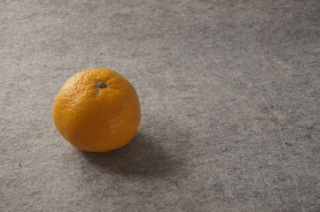 Mandarin on a gray background.Healthy food
