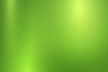 Green foil metallic wall with glowing shiny light, abstract texture background © AITTHIPHONG