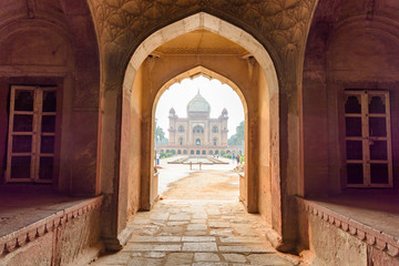 Fototapeta na wymiar View of Safdarjung's Tomb through arched gate in Delhi, India