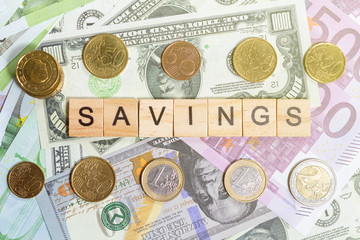 word savings on the money banknotes background