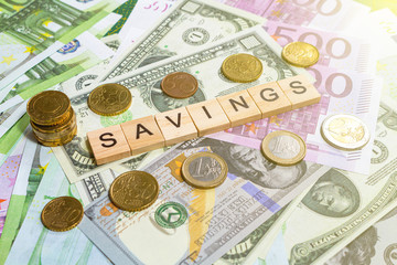 word savings on the money banknotes background