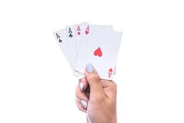 Gambling concept. Female hand holding combination of four aces isolated on white