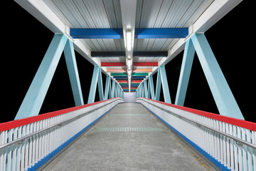 Modern empty foot bridge at night