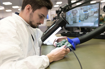 Apprentice working in microelectronics lab