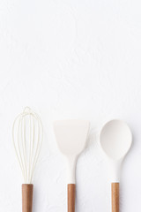 Kitchen tools background. Kitchen utensil, whisk, spatula. Blank space for a text. Copy spaces