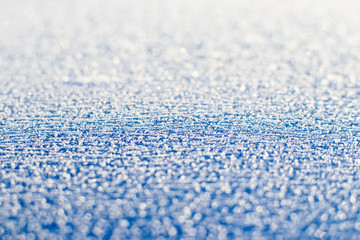 Blue snowy surface.