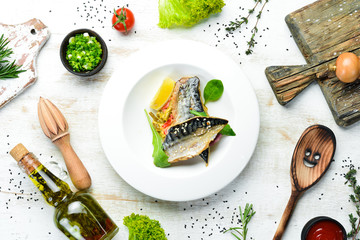 Baked mackerel fillet with vegetables. Top view. Free space for your text.