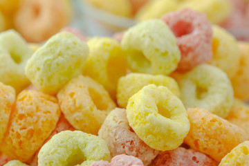 Close-up of cereal flakes food back ground.Food with delicious fruity taste and fruity colours.It's made with maize,wheat,and barley