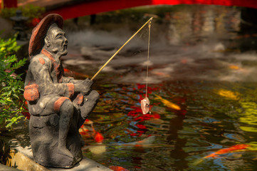 Artificial clay fisherman sculpture fake fishing in fancy Carps fish pond