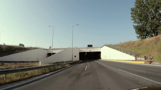 Drive pov, Entering road tunnel in the mountains in Greece