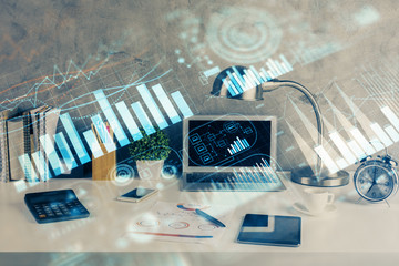 Multi exposure of chart and financial info and work space with computer background. Concept of...