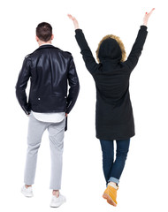 Back view of couple in winter jacket.