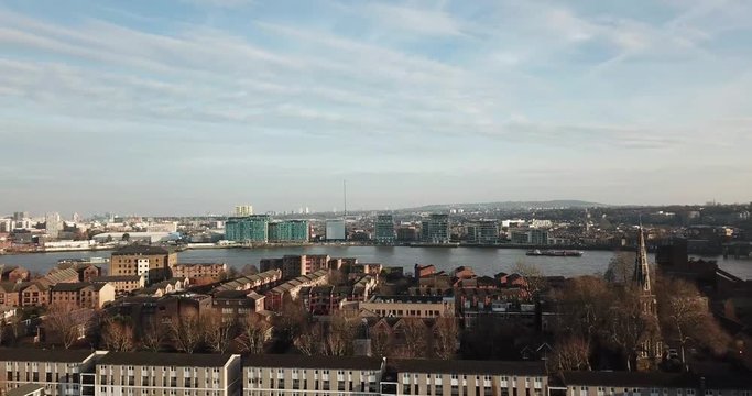 An aerial drone view of Millwall and Island Gardens towards Thames river of London
