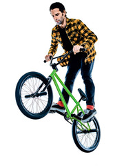 Fototapeta premium one young caucasian man BMX rider cyclist cycling freestyle acrobatic stunt in studio isolated on white background