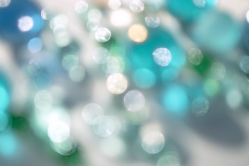 Obraz premium Bright delicate natural bokeh background. Circles of defocused light. Abstract bright shiny background.