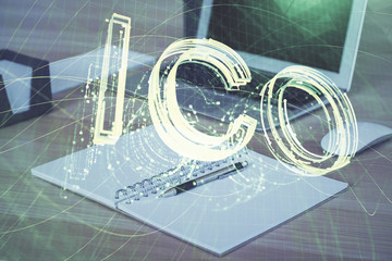 Double exposure of blockchain theme hologram and table with computer background. Concept of bitcoin...