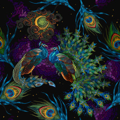 Embroidery peacocks, magic moon and fethers, seamless pattern. Fairy tale style. Fashionable template for design of clothes. Tropical forest art