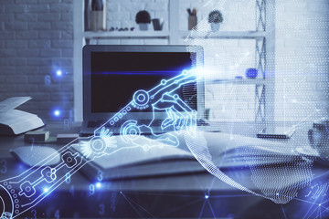 Computer on desktop in office with technology theme hologram. Multi exposure. Tech concept.