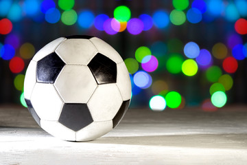 Soccer ball on bokeh lights background