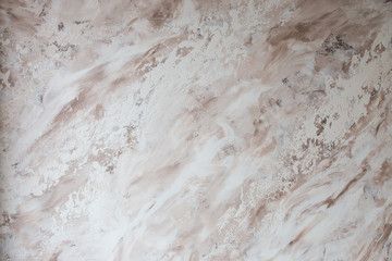 The gray wall texture is shot with a shallow depth of field