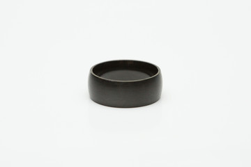 Black wedding ring on a  white background