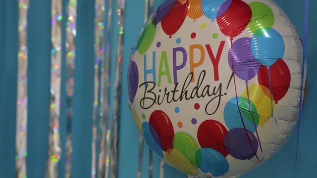 Happy birthday balloon on children party yellow blue colors design decorations background
