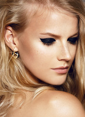 close-up beauty shot of young pretty model with bright make-up. Dark eyes. Eyeliner  - 315013513