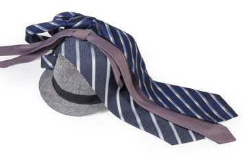 Men's ties lying on the lightweight cotton fedora hat