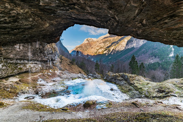 Winter. Ice games in the Fontanon of Goriuda waterfall. Friuli, Italy.