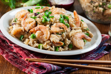 Fried rice with shrimp and vegetables served on a plate