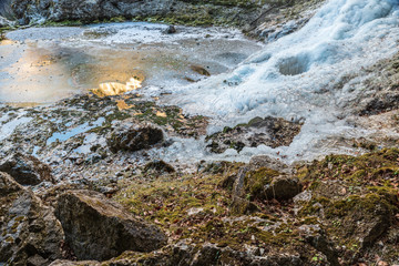 Winter. Ice games in the Fontanon of Goriuda waterfall. Friuli, Italy.