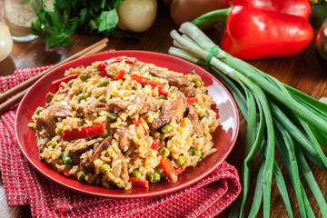 Fried rice with chicken and vegetables served on a plate
