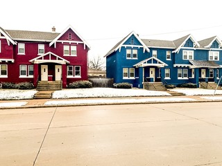 line of townhouses in winter snow