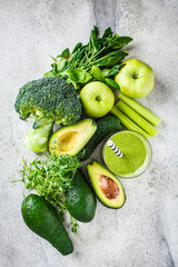 Ingredients for green detox smoothie background, top view, flat lay.