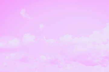 Pale pink sky background with soft delicate clouds. Copy space, romantic background