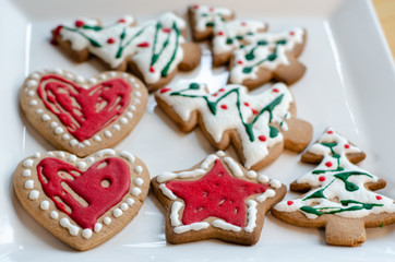 Christmas cookies on white plate.