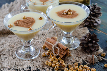 Traditional turkish drink; boza with cinnamon sticks and chickpea