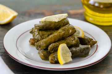 Stuffed grape leaves with rice,olive oil and herbs in white plate