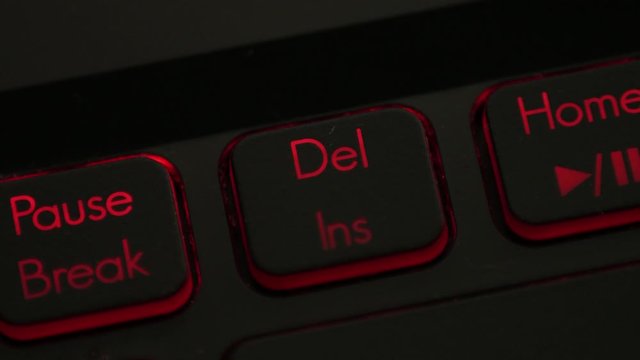 clicking finger pressing del delete button on keyboard computer multiple times, angry