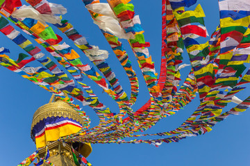 Colorful prayer flags on to the Boudhanath stupa in Kathmandu, Nepal