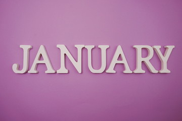 January alphabet letters on purple background