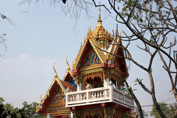 Fototapeta premium Carved multi-colored wooden building in Thailand