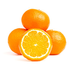 Sliced round halves of orange fruit and whole citrus isolated on white background