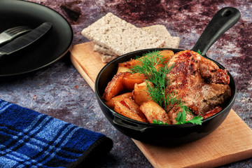 Oven-baked chicken with vegetables and herbs. Home made food. Concept for a tasty and hearty meal.